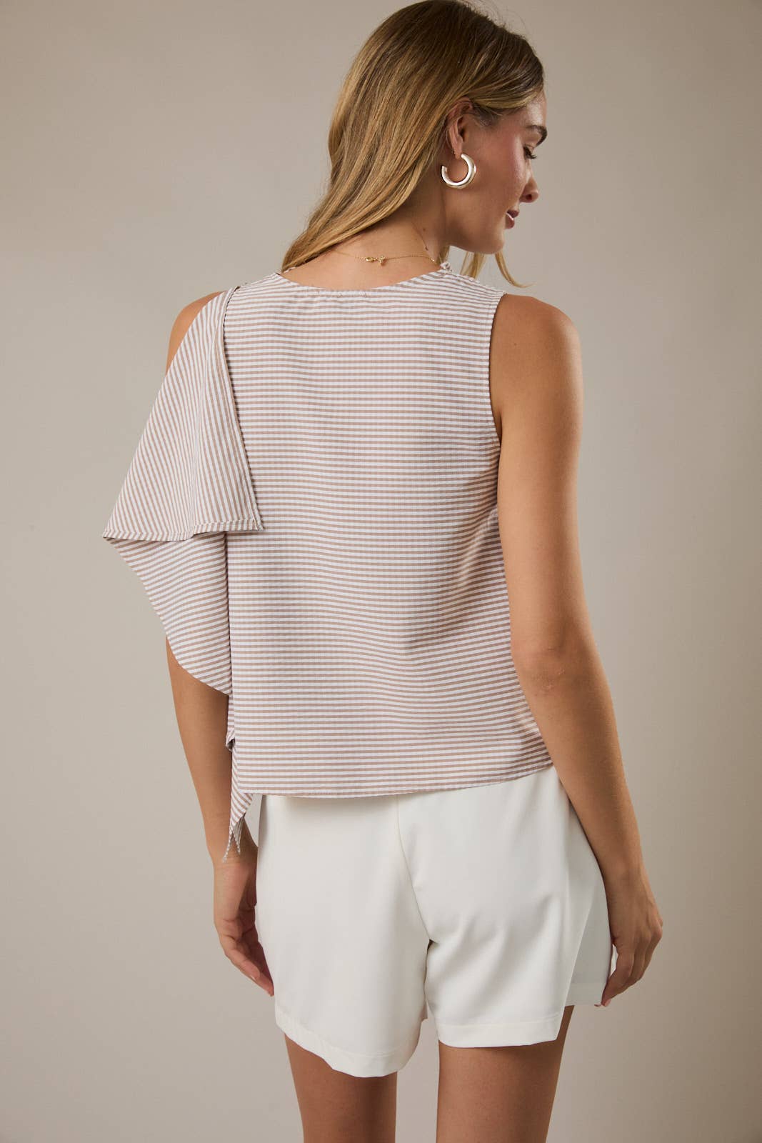 SLEEVELESS TOP WITH ASYMMETRICAL RUFFLE DETAIL