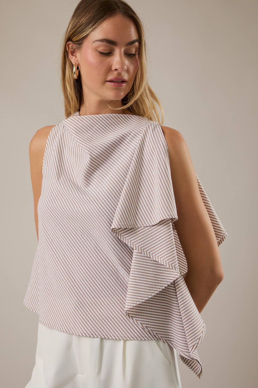 SLEEVELESS TOP WITH ASYMMETRICAL RUFFLE DETAIL