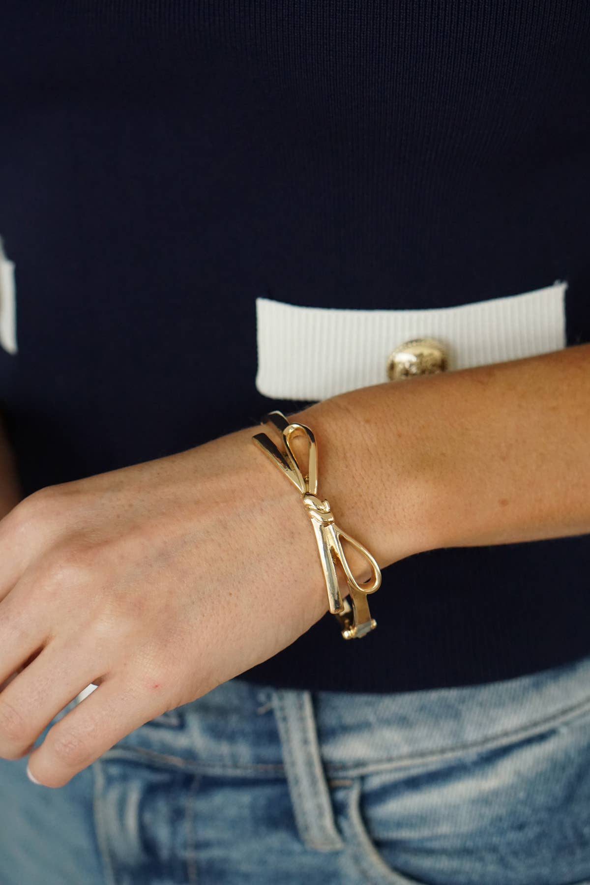 Karina Bow Wrapped Hinge Bangle in Shiny Gold